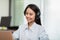 Happy Telemarketer Asian woman wear headset smile