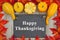 Happy Thanksgiving with autumn leaves with a retro chalkboard wi