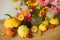 Happy Thanksgiving! Autumn moody still life, atmospheric image. Colorful autumn flowers, pumpkins, pattypan squashes composition