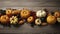 Happy Thanksgiving concept. Composition with ripe orange pumpkins, fallen leaves, dry flowers on rustic wooden table