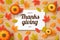 Happy thanksgiving day background with autumn leaves, pumpkins and wooden background.