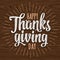 Happy Thanksgiving day calligraphy handwriting lettering with ray. Vector illustration on wood