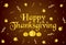 Happy Thanksgiving gold text, ribbons, pumpkins and leaves.