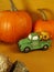 Happy thanksgiving, green truck, sunflower delivery, orange pumpkins, rocks