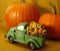 Happy thanksgiving, halloween,  green vintage toy truck, sunflower, pumpkin delivery