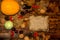 Happy Thanksgiving and harvest festival concept.Top view of mini pumpkins, cabbage, colored leaves, walnuts, chestnuts, pine cones