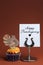 Happy Thanksgiving message with orange cupcake with turkey decoration - vertical.