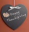 Happy Thanksgiving message written on heart shape blackboard