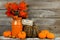 Happy Thanksgiving tag with autumn decor against wood