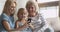 Happy three age intergenerational women family having fun with cellphone