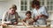 Happy three generations family enjoying cooking in kitchen.