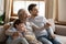 Happy three generations male family watching football championship match.