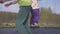 Happy three year old girl jumping on a trampoline. Emotional joyful portrait. Slow motion