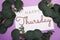 Happy Thursday text decoration with eucalyptus leaves on purple background