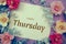 Happy Thursday typography text and flower decorate on purple background