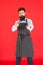 Happy to cook for you. Modern cafe concept. Cooking modern meals. Man with beard cook hipster apron. Hipster chef cook
