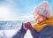 Happy toddler baby boy playing snowballs with family at sunny winter day