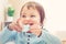 Happy toddler girl drinking from a teacup