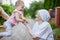 Happy toddler girl and her great grandmother looking at one another and laughing