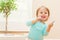 Happy toddler girl playing with chalk