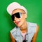 Happy Tomboy Model in Fashion Accessories Cap and Sunglasses