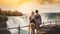 Happy tourist couple enjoying the view to Niagara Falls during romantic vacation. People looking to nature landscape at sunset