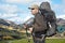 Happy tourist man on a background of mountainous terrain