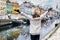 A happy tourist woman enjoys the view to the beautiful Nyhavn area in Copenhagen