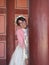 happy tourist woman in pink Korean traditional dress