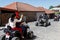 Happy tourists riding all terrain vehicle on street of the medieval town Sighnaghi