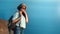 Happy travel contemplative woman in hat sunglasses looking at amazing sea landscape from mountain