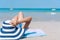 Happy traveler Asian woman enjoy sunbathing at tropical beach on vacation. Summer on beach concept