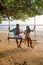 Happy traveler couple relaxing on swing and looking beautiful nature landscape , Andaman sea, Krabi, Tourist sea beach