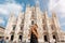 Happy traveler girl in Milan city. Tourist woman posing near Duomo cathedral in Milan, Italy, Europe