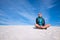 Happy traveler relax among sand dunes