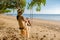 Happy traveler womn in hammock relaxing on swing and looking beautiful nature landscape , Andaman sea, Krabi, Tourist