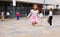 Happy tweenager girl skipping rope in schoolyard