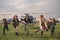 Happy tweenager girls running on airfield after flying in helicopter