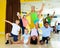 Happy tweenagers with choreographer in dance studio