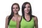 Happy twin sisters wearing green tops