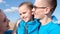 A happy Ukrainian family in the middle of a wheat field, they are dressed in blue and yellow clothes