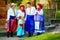 Happy ukrainian family in traditional costumes on their homestead