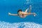 Happy underwater kid in swimming pool