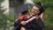 Happy university friends hugging warmly, congratulations on graduation ceremony
