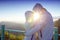 Happy Valentine: lovers amidst scenic mountain fog and sun