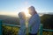 Happy Valentine: lovers amidst scenic mountain fog and sun