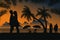 Happy Valentine. Romantic couple on the beach at night with beach background and coconut tree silhouette