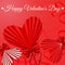 Happy Valentine\\\'s Day greeting card with three decorated origami hearts with satin bows and ribbons.