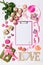 Happy Valentine`s day. Roses flowers, LOVE text, hearts, gifts and decorative items in pink pastel colors with clipboard. Greetin