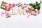 Happy Valentine`s day. Roses flowers, LOVE text, hearts, gifts and decorative items in pink pastel colors on white background.